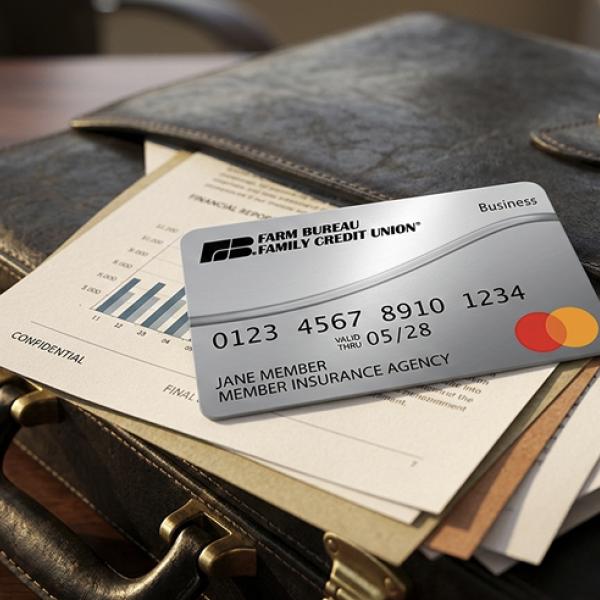 a Farm Bureau credit card sitting on a briefcase 