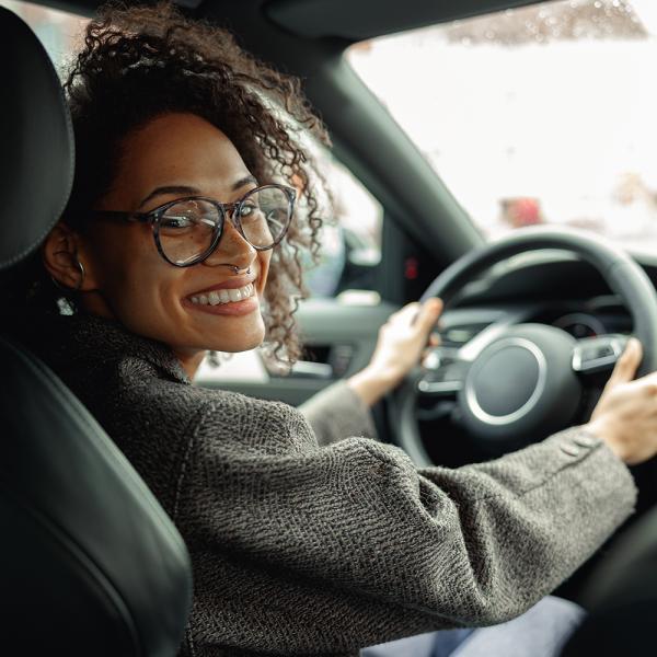 Woman behind the wheel of her car